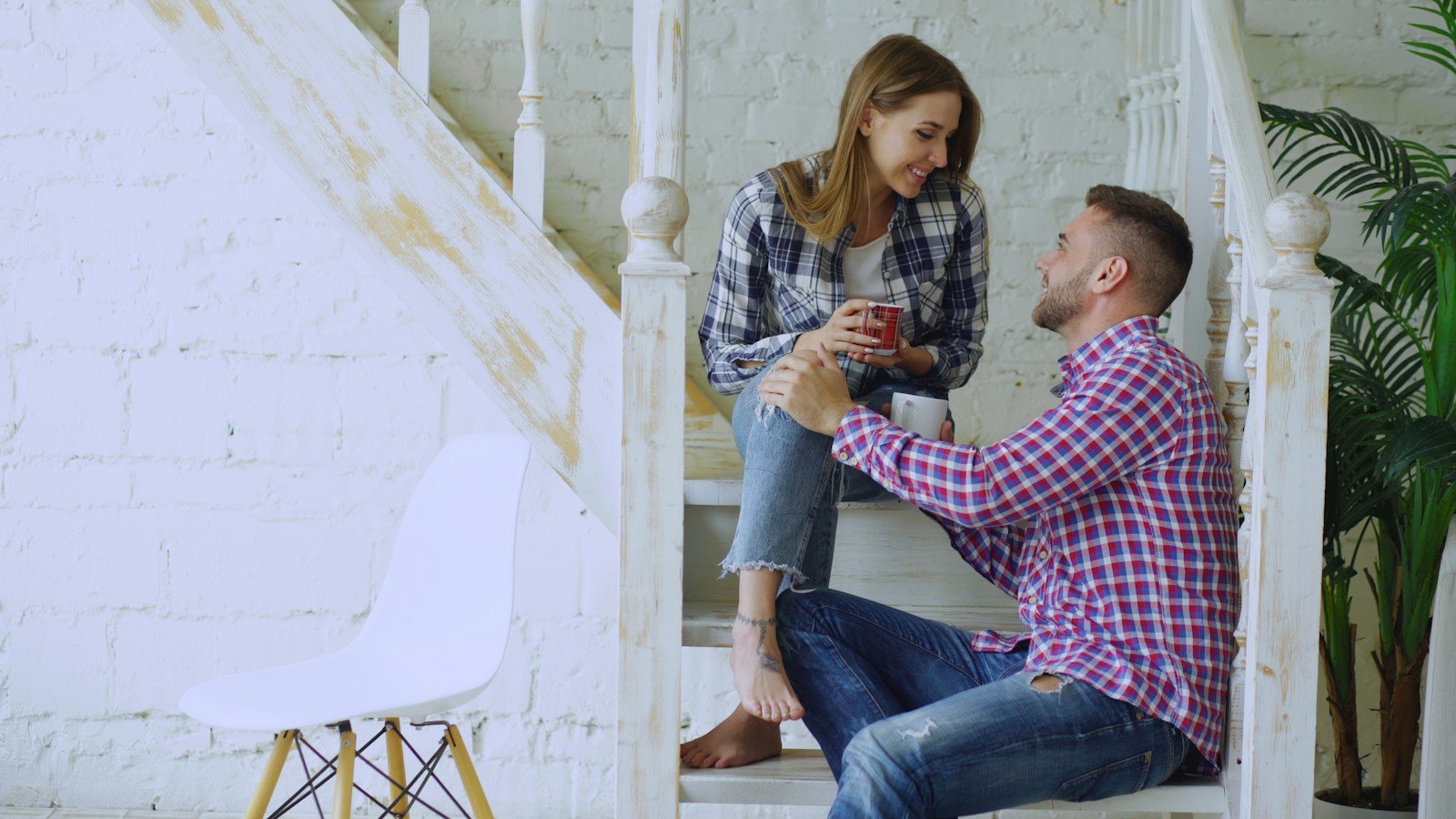Couple sitting together at home and having a calm conversation about rebuilding trust